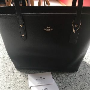 Never before used Coach bag. NWOT